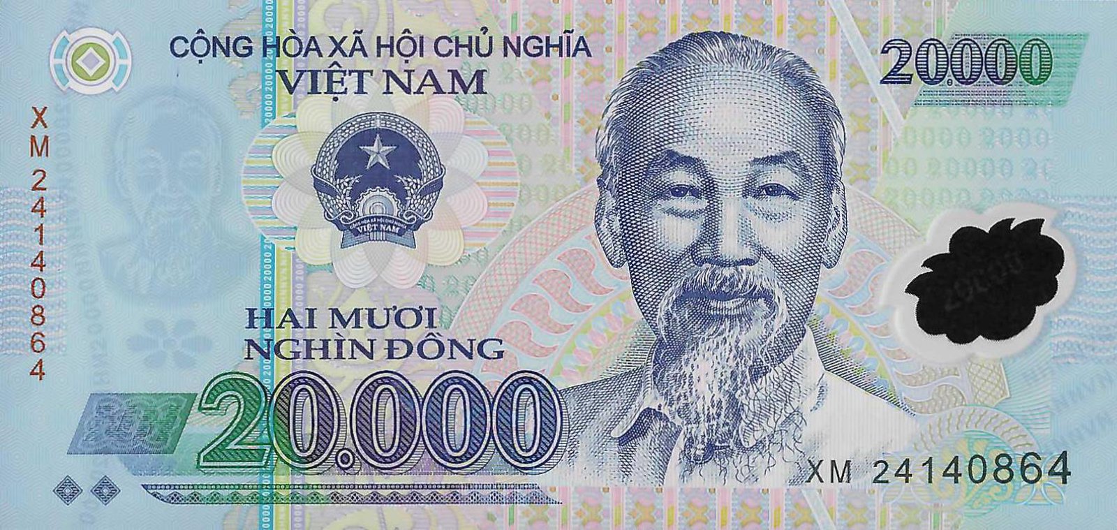 Obverse of the 20,000 đồng Vietnamese polymer banknote: engraved portrait of Hồ Chí Minh, State Emblem of Vietnam, denomination "20.000" and the legend "HAI MƯƠI NGHÌN ĐỒNG" on a turquoise-blue polymer ground, with a clear transparent window at the right (serial XM 24140864)