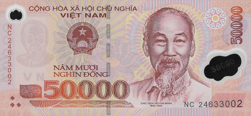 Obverse of the 50,000 đồng Vietnamese polymer banknote: engraved portrait of Hồ Chí Minh, State Emblem of Vietnam, denomination "50.000" and the legend "NĂM MƯƠI NGHÌN ĐỒNG" on a pink polymer ground, captioned "CHỦ TỊCH HỒ CHÍ MINH 1890–1969" (serial NC 24633002)